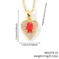 Detailed view of a gold-colored heart pendant necklace with a red stone and zirconia - Ruby Red-Gold Tone (N01579-15)