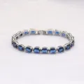 Elegantes Tennisarmband mit blauen Kristallen und oval geschliffenen Zirkoniasteinen. - 19cm / Silber mit Blauem Diamant