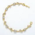 Elegante goudkleurige bladarmband met heldere zirkonia in marquise- en ovaalvorm - Goud