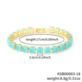 Close-up detail of the elegant gold-plated tennis bracelet with vibrant blue round zirconia stones. - Gold Aquamarine Stone