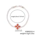 Elegant silver-colored clover bracelet with orange stones and shimmering cubic zirconia - White K Red