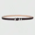 Close-up detail of slim women's dark brown leather belt with shiny silver metal buckle. - Coffee