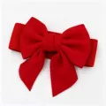 Detailweergave van een levendige rode elastische tailleriem met een grote strik. - Rood