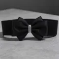 Black elastic wide belt featuring a satin bow and sparkly rhinestone center buckle for dresses. - Black