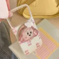 Close-up of glitter iPhone case with 3D cartoon chef puppy grip and shimmering finish - Compatible Model: 17promax / White Magnetic Glitter Cookie Dog With Cookie Stand