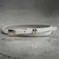 Minimalist white leather belt for women with sleek gold buckle, chic waist accessory. - White
