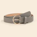 Gray women belt detail view featuring a shiny gold round pin buckle and fine texture. - Gray