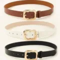 Close-up view of three stylish women's belts in brown, white, and black with gold buckles. - 102cm / Three-Piece Set