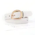 Close-up of a white faux leather belt featuring a polished gold irregular oval buckle. - White