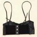 Detail view of black leather suspender corset belt with silver snaps and elastic band - Black