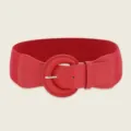 Detailed shot of a stylish red wide elastic waist belt with a matching round buckle. - 70x6cm / Red