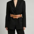Details of French retro wide leather belt, double wrap design and metal buckle styling view. - Brown