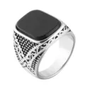 Detailed side view of a stainless steel signet ring with a black square stone. - US 7 / Steel Black Stone
