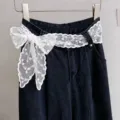 White lace bow mesh ribbon belt on dark denim jeans, chic waist decoration for women. - Small White Flower
