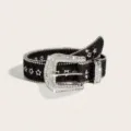 Macro view of a black belt with sparkling rhinestones and star-shaped metal eyelets - 102 cm / Regular Fit / Black