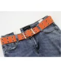 Ceinture en toile orange à double œillets avec un jean en denim - Taille Unique 100cm / Orange