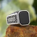 Detailed macro shot of vintage men's titanium steel ring with black onyx stone - Size 7 / Steel