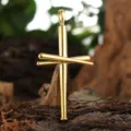 Detailed close-up of gold-plated baseball bat cross pendant displayed on wood bark - Pendant Only - Gold (XD1297)