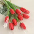 Artificial red tulips bouquet in clear plastic wrap, perfect for home and table decor. - Upgraded Red Tulips, 10 Stems