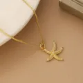 Detailed close-up of golden starfish pendant necklace with elegant box chain - Large Starfish