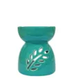 Elegante quemador de cera de cerámica verde azulado con diseño de hoja calada. - Cian