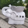 Quemador de aceite de aromaterapia de cerámica blanca con forma de elefante y pétalo - Blanco
