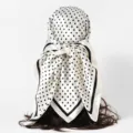 Back view of a white satin square scarf with black polka dots tied on a hair prop - 90x90cm / S Polka Dot-Rice White