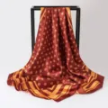 Detailed view of elegant burgundy silk-like square scarf with stylish gold polka dots - 90x90cm / K133-Coffee