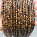 Macro detail view of 2x4mm natural tiger eye stone flat disc beads for DIY jewelry making - Disc Shape / 155 Pieces/Strand / Natural Yellow Tiger Eye