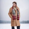 Professional outdoor shot of a man wearing a camel wool coat in a snowy landscape - M / Tops / Khaki