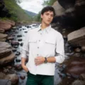 Detail showing minimalist light grey men's shirt jacket in an outdoor stream setting - S / Tops / White