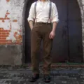 Detailed view of men's vintage style casual trousers, showcasing fabric texture and fit. - S / Coffee