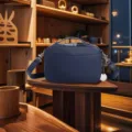 Detail of navy blue vintage camera crossbody bag with multi-functional compartments and handle - Blue