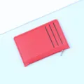 Ultra-thin vibrant red leather card holder featuring three card slots and a side zipper - Red