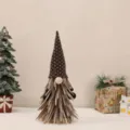 Detailed view of handmade Christmas gnome with tall knitted hat and felt beard - Brown Large (30cm)