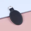 Elegante zwarte ovale PU-lederen sleutelhanger met witte stiksels en metalen ring - Zwart