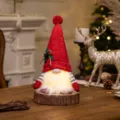 LED glowing Christmas gnome plush doll with red knitted hat and warm beard light on wood base - Red