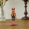 Gingerbread themed wooden nutcracker soldier ornament with cute candy cane details - Orange Snowman Style