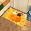 Vibrant yellow Halloween doormat with cartoon pumpkin, ghost, and black cat motifs. - Cat Ghost Pumpkin Style (CHDT-2024-01339)