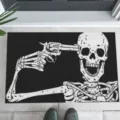 Halloween doormat featuring a horror skeleton with a gun graphic on black background - Laughing Skeleton with Gun (CHDT-2024-01285)
