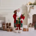 Standing Santa Claus doll holding a Christmas tree for holiday window display decoration - 30cm / Deep Red Velvet & Green Sequin Vest Style (SCD2626)