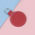 Porte-clés circulaire créatif en similicuir rouge avec anneau en métal et surpiqûres blanches - Bordeaux