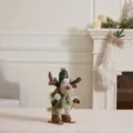 Standing plush Christmas reindeer skiing figurine with a clover green hat decoration - Skiing Reindeer (Round Hat) / Mallow Green