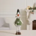 Adorable Christmas plush goose wearing an alfalfa green hat and a cozy winter outfit - Telescopic Christmas Duck (Round Hat) / Mallow Green