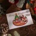 Tarjeta de Navidad con texto Merry Christmas en pan de oro e ilustración de postres. - Dessert Illustration (1)