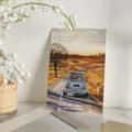 Tarjeta de felicitación artística en acuarela con un coche antiguo en una carretera escénica - Freedom in the Wind