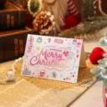 Cartoon Christmas greeting card with Merry Christmas text and festive holiday motifs - Pink Gradient Greetings And Gift Box Style (2025111702-2)