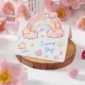 Lovely hand-drawn doodle greeting card featuring a rainbow design and 'Sunny Day' text - Small Rainbow (2026053102)