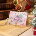 Hand-drawn cartoon Christmas greeting card with Merry Christmas calligraphy text - Purple Artistic Font And Santa Claus Style (2025111702-6)