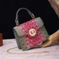 Detailed view of vintage gradient crocodile embossed handbag with gold twist lock - Pink and Green-Gray Gradient
